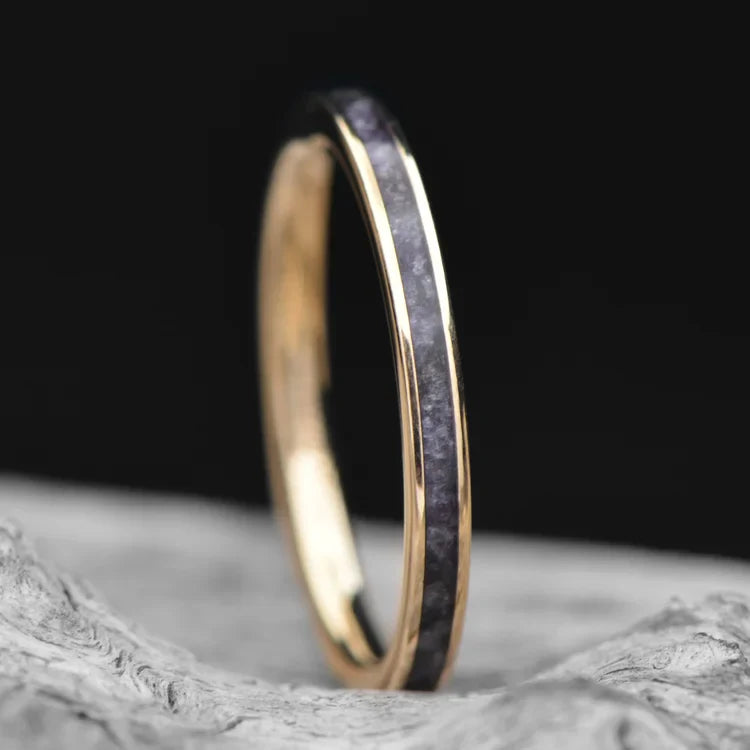 14K yellow gold wedding band with central amethyst inlay, 2mm womens ring, custom polished flat profile, displayed on a white sea branch, free engraving available