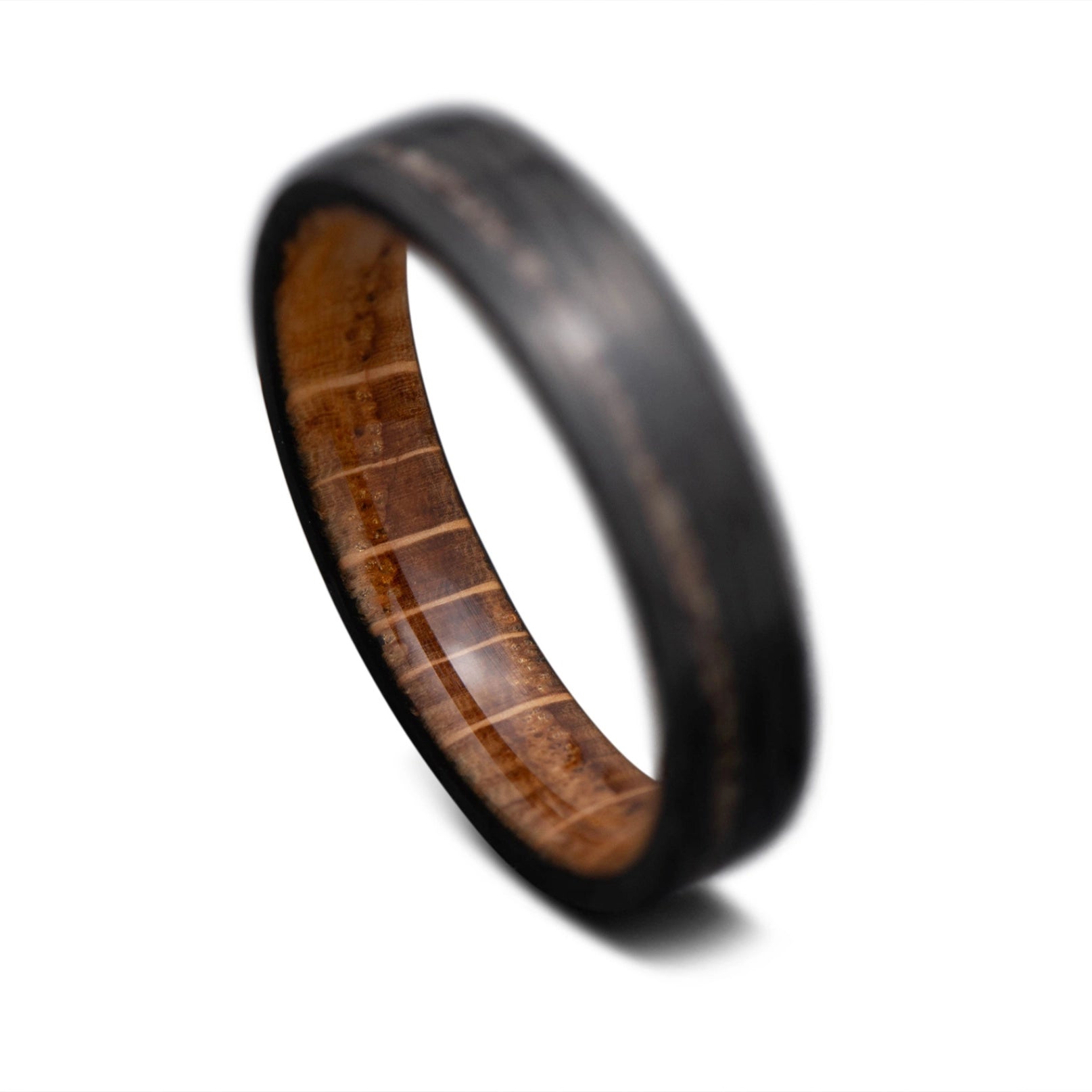 Carbon Fiber Wave ring with TRex Inlay and Whiskey Barrel Wood Sleeve