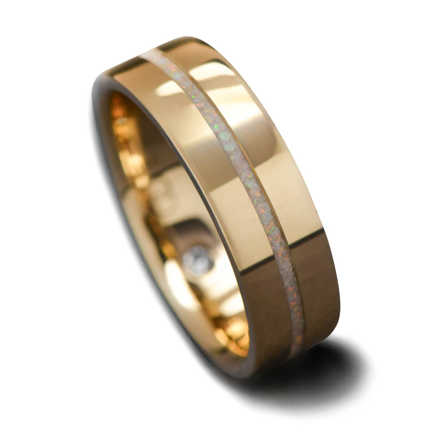 14K yellow gold mens wedding band with central pearl opal inlay and flush set diamond, polished flat profile, 6mm width, shown on a hand, free engraving available