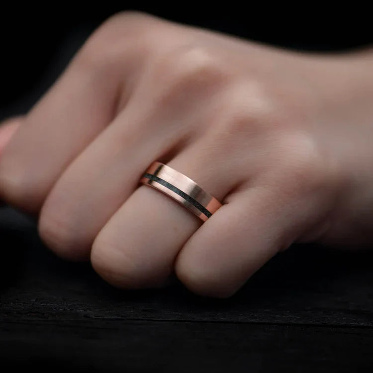 14K rose gold wedding band with moss agate inlay on a hand, featuring free engraving, 6mm mens brushed flat profile, unique custom ring design.
