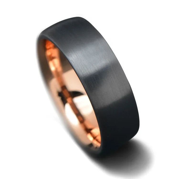 Black titanium wedding band with 18K rose gold inner sleeve, 7mm mens wedding ring, brushed domed profile, free engraving, on a white background.