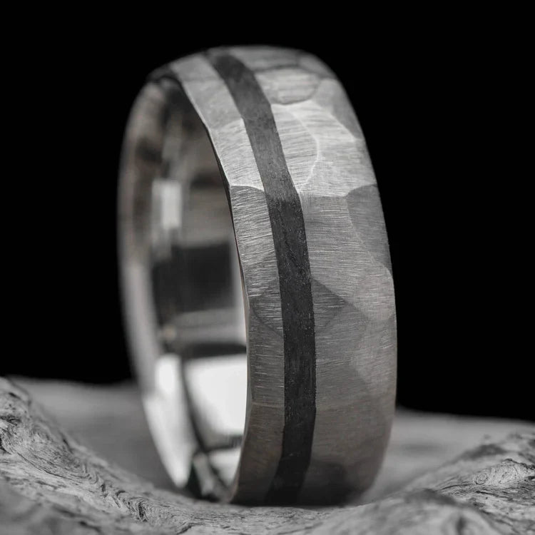 14KW mens wedding band with unidirectional inlay, 7mm faceted domed profile, custom design, free engraving, displayed on white sea branch.