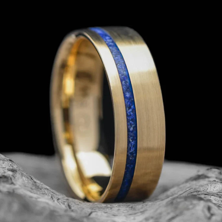 14K yellow gold wedding band with lapis lazuli inlay, featuring free engraving, 6mm width, mens brushed flat profile ring, unique design, displayed on a white sea branch background.