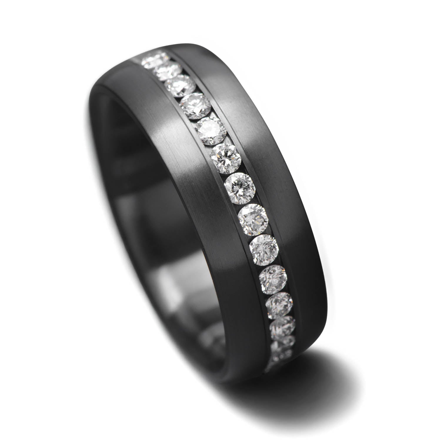 Zirconium wedding band with eternity set precious stones, mens 6mm brushed domed profile ring, displayed on a white sea branch, free engraving available.