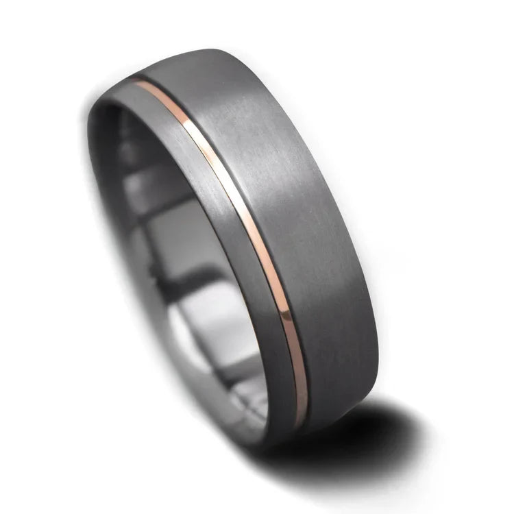 Tantalum wedding band with 18K rose gold inlay, 7mm mens sandblasted domed ring, unique mens wedding band, free engraving available, displayed on a white background.