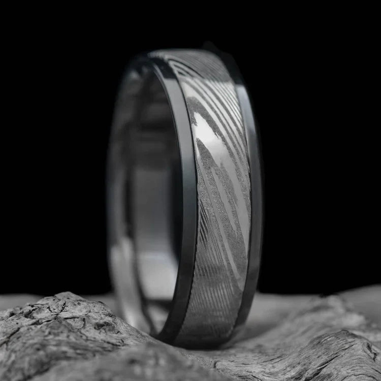 Zirconium ring with central dense twist inlay, mens wedding band, 7mm, polished domed profile, unique design, free engraving, displayed on a white sea branch.