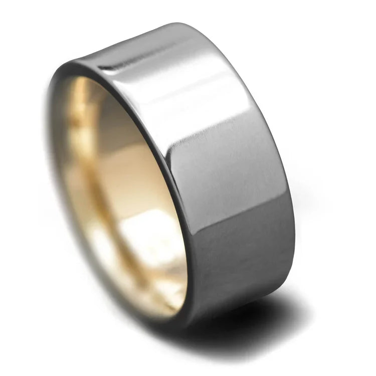Titanium wedding band with 10K yellow gold inner sleeve, featuring a polished flat profile, 9mm width, mens wedding ring with free engraving option, displayed on a white background.