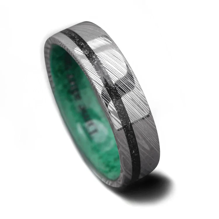 Heimskringla mens wedding band featuring meteorite and malachite inlays, 6mm width, unique custom design with free engraving option, displayed on a white background.