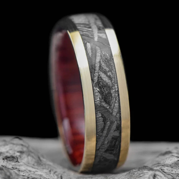 10KY gold wedding band with central meteorite inlay and bloodwood inner sleeve, 7mm mens ring on white sea branch, unique mens wedding ring, free engraving available