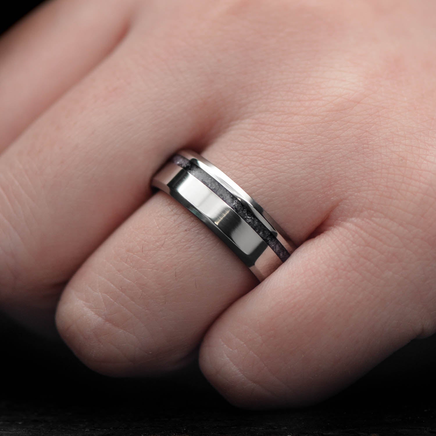 Mens titanium wedding band with amethyst inlay, 7mm width, polished bevel profile, unique design, free engraving available, displayed on a white background.