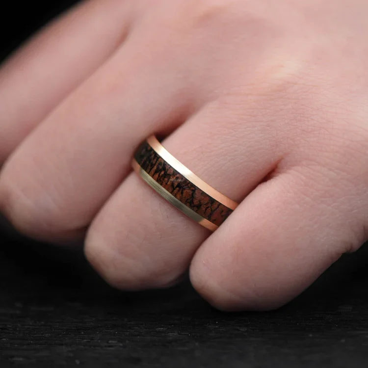 10KY gold mens wedding band with solid T-Rex central inlay, 7mm wide, shown on a hand; unique custom ring with free engraving option.