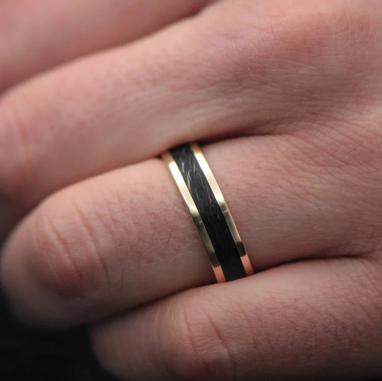 10KY Gold Wedding Band with Central Forged Inlay, 6mm Mens Ring, Custom Brushed Flat Profile, Free Engraving, displayed on a white sea branch