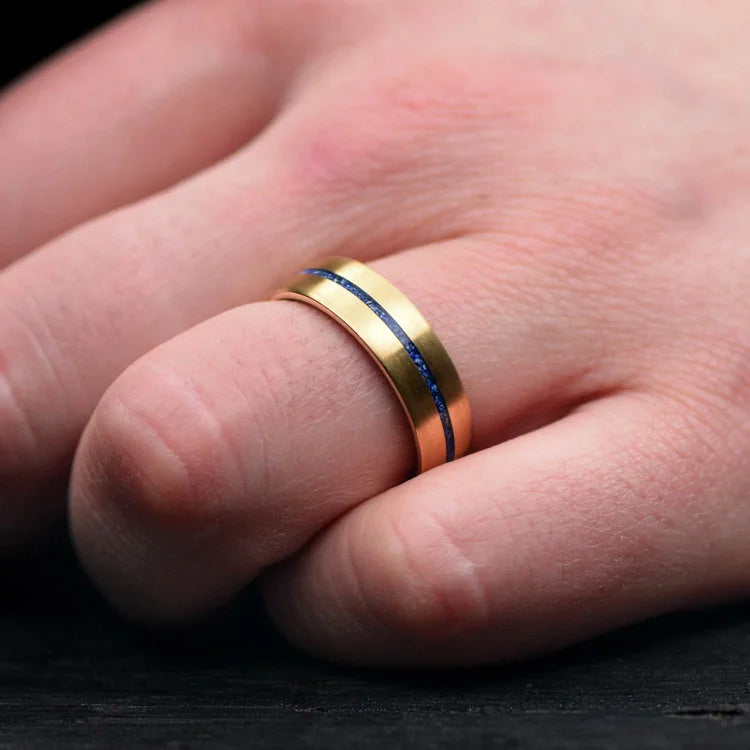 22KY gold wedding band with lapis lazuli inlay and African blackwood sleeve on a hand, 7mm mens unique ring, free engraving available, elegant mens wedding ring.