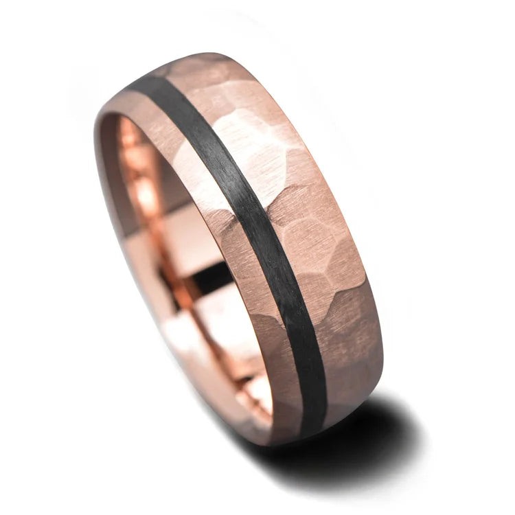 14K rose gold mens wedding band with unidirectional inlay, 7mm faceted domed profile, custom ring with free engraving, shown on a hand.