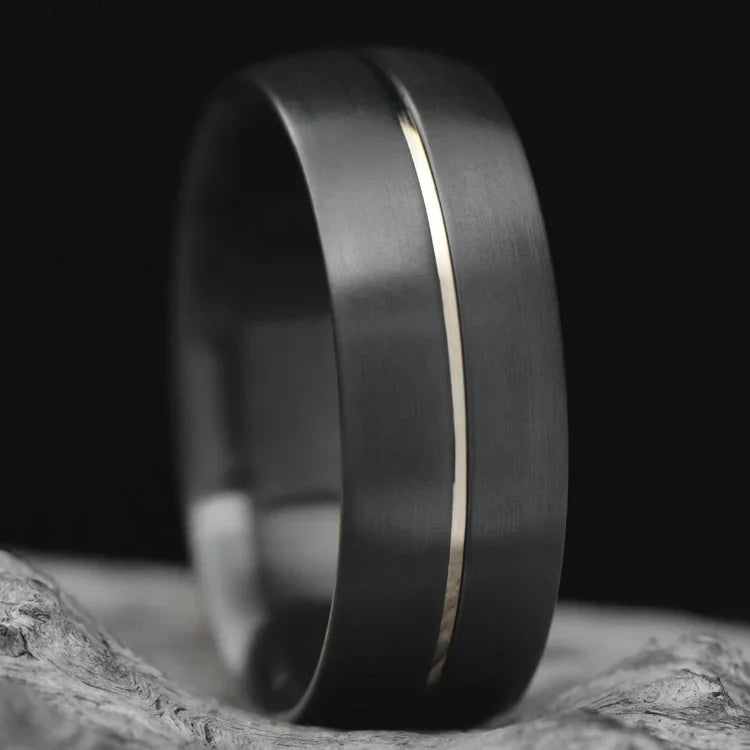 Zirconium wedding band with 14KW inlay, free engraving, 8mm mens wedding ring featuring a brushed domed profile, unique mens ring displayed on a white sea branch.