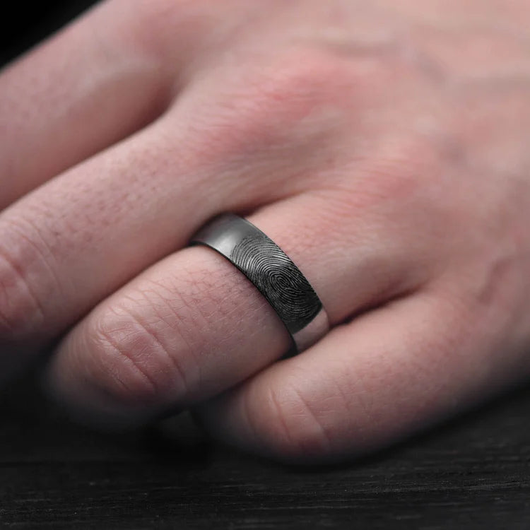 Black titanium wedding band with bloodwood inner sleeve, 7mm mens domed polished ring, unique mens wedding band, free engraving, displayed on a white background.