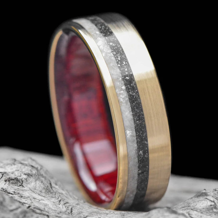 14K yellow gold wedding band with pearl and meteorite inlays, featuring a bloodwood inner sleeve, displayed on a white sea branch; mens unique 7mm wedding ring with free engraving.