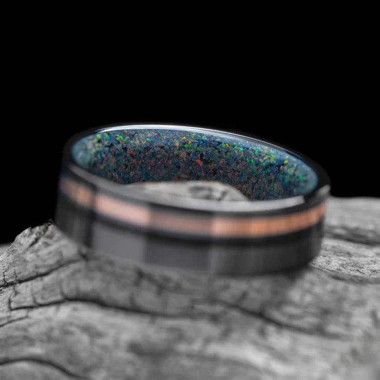 Black Titanium Wedding Band with 10K Rose Gold and Black Onyx Inlays, Black Fire Opal Inner Sleeve, 7mm Mens Wedding Ring, on White Sea Branch, Free Engraving, Brushed Finish