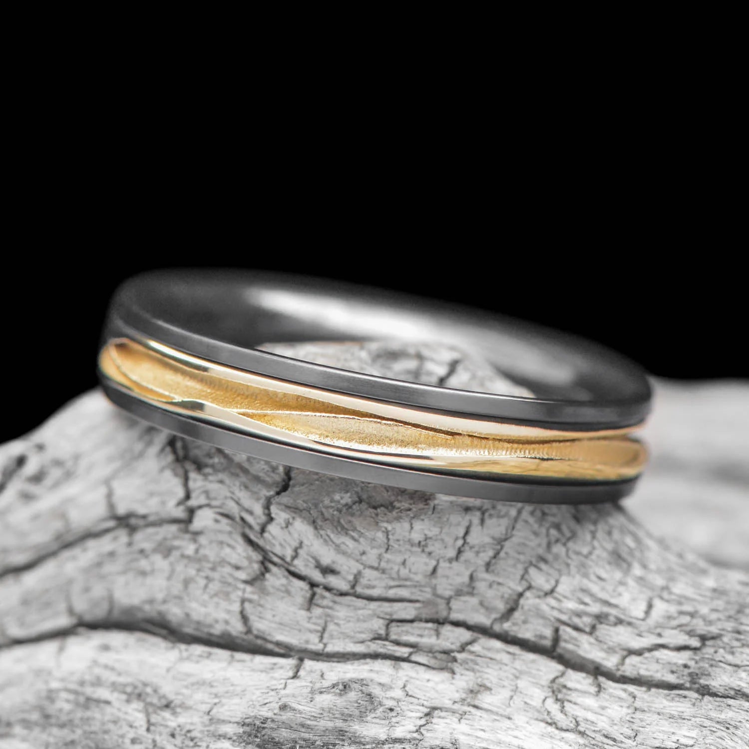 ALT text: Black Titanium Ring with 18KY Wave Central Inlay on White Sea Branch - Men's 4mm Polished Domed Profile Wedding Band with Free Engraving