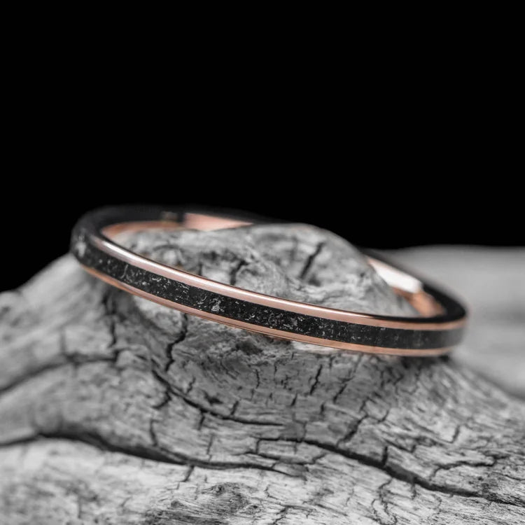 14K Rose Gold Wedding Band with Central Meteorite Inlay, 2mm Womens Unique Custom Design, displayed on a white sea branch, free engraving available