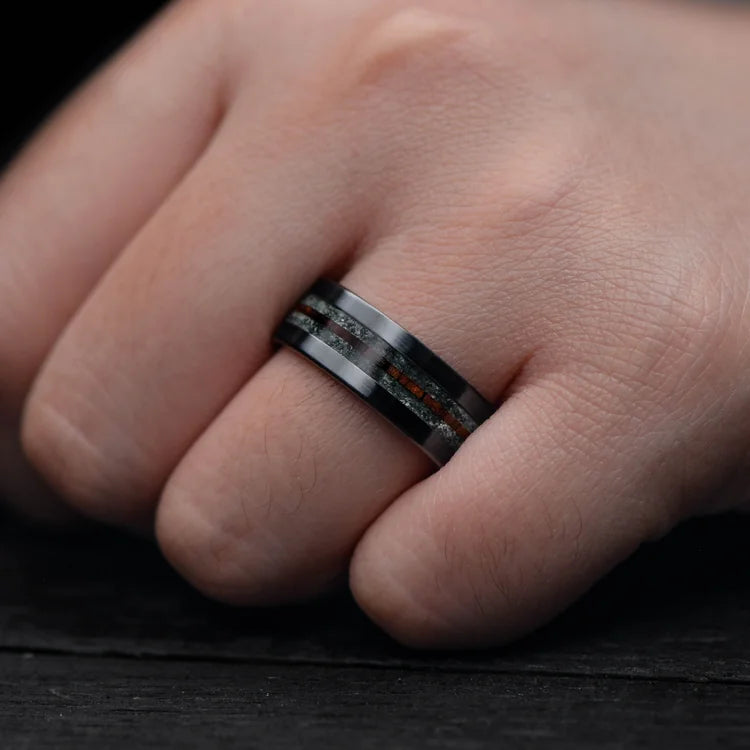 Mens Black Titanium Wedding Band with Moss Agate and Central Koa Inlay, 8mm, shown on hand, unique mens ring with free engraving option.