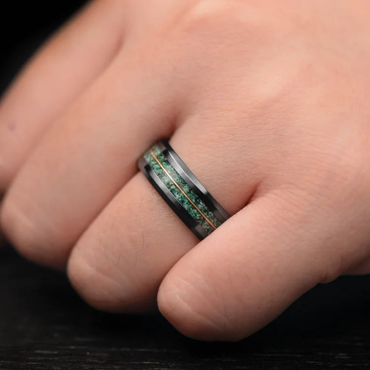 Black titanium wedding band with dual turquoise and central guitar string inlay, 7mm mens ring, unique design, free engraving, displayed on a white sea branch.
