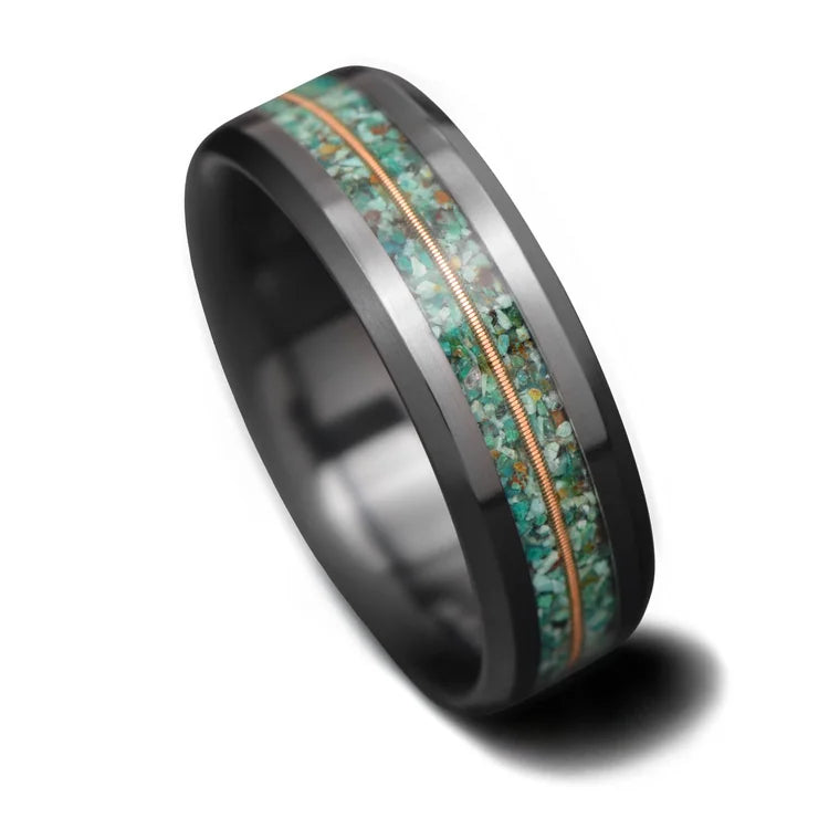 Black titanium wedding band with dual turquoise and central guitar string inlay, 7mm mens ring, unique design, free engraving option, displayed on a white background.