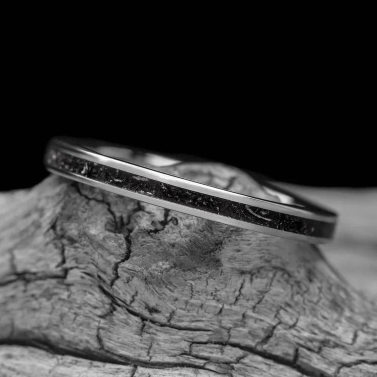 14KW womens wedding band with central meteorite inlay, flat brushed custom design, 2mm width, free engraving, displayed on a white sea branch background.