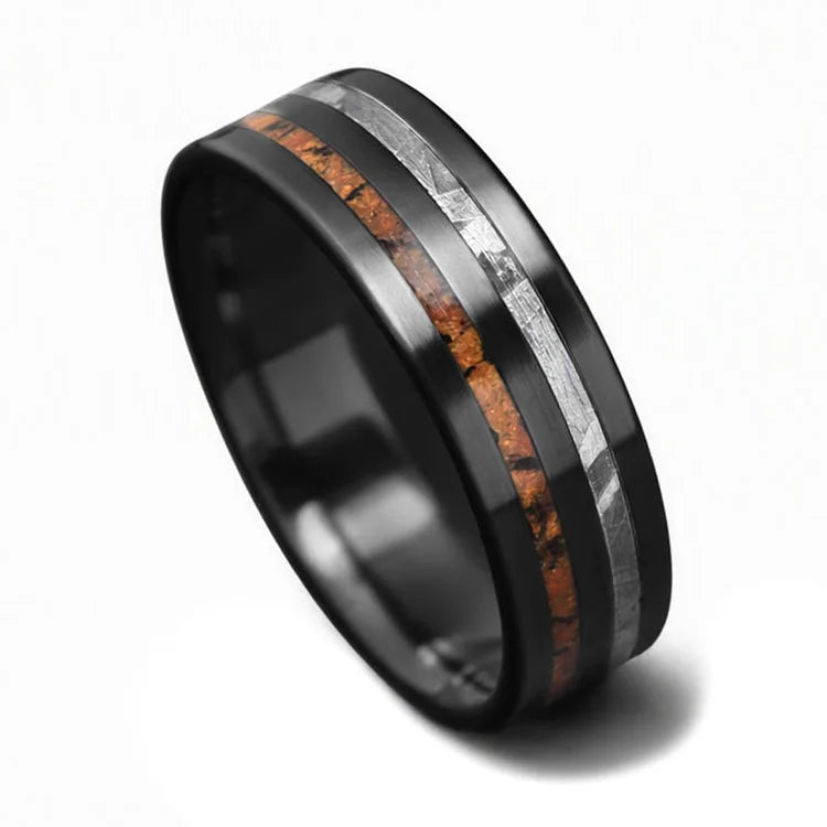 Black titanium wedding band with solid meteorite and T-Rex inlays, 7mm mens unique wedding ring, featuring free engraving, displayed on a white background.