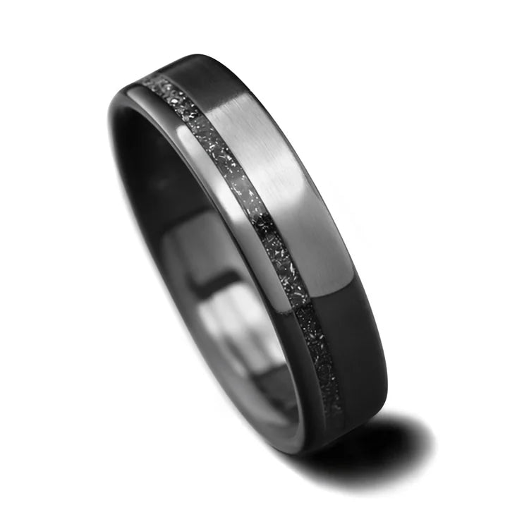 Black titanium wedding band with meteorite inlay, 5mm custom flat brushed design, unique simple wedding ring, free engraving option, displayed on a white background.