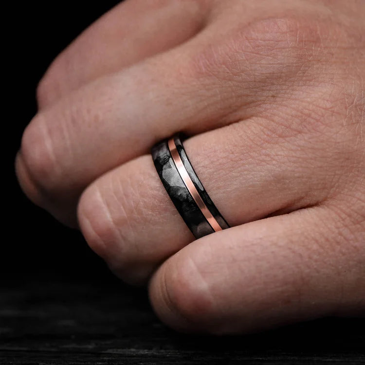 Mens wedding band on hand, Black Titanium Ring with 14K Rose Gold Inlay, Bloodwood Inner Sleeve, 7mm, Faceted Flat Profile, free engraving available.
