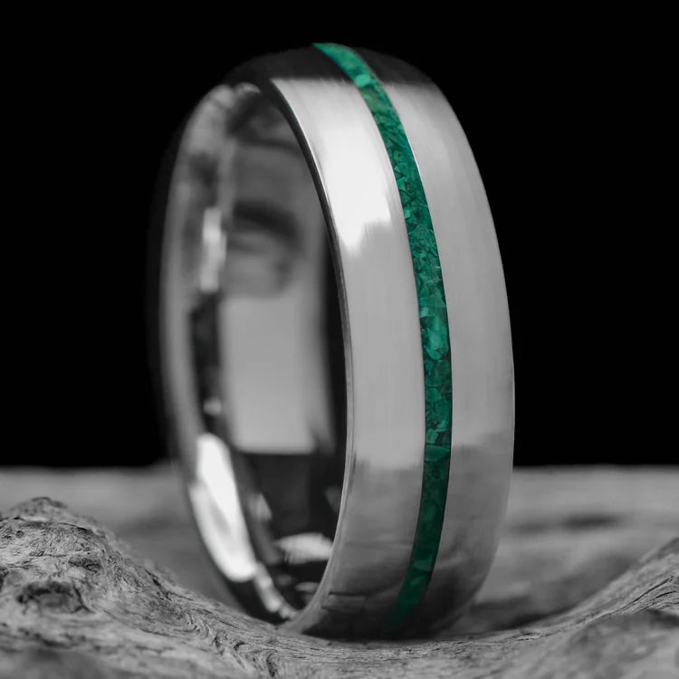 14KW wedding band with central malachite inlay, brushed domed mens ring, 6mm width, custom design, free engraving, displayed on white sea branch background.