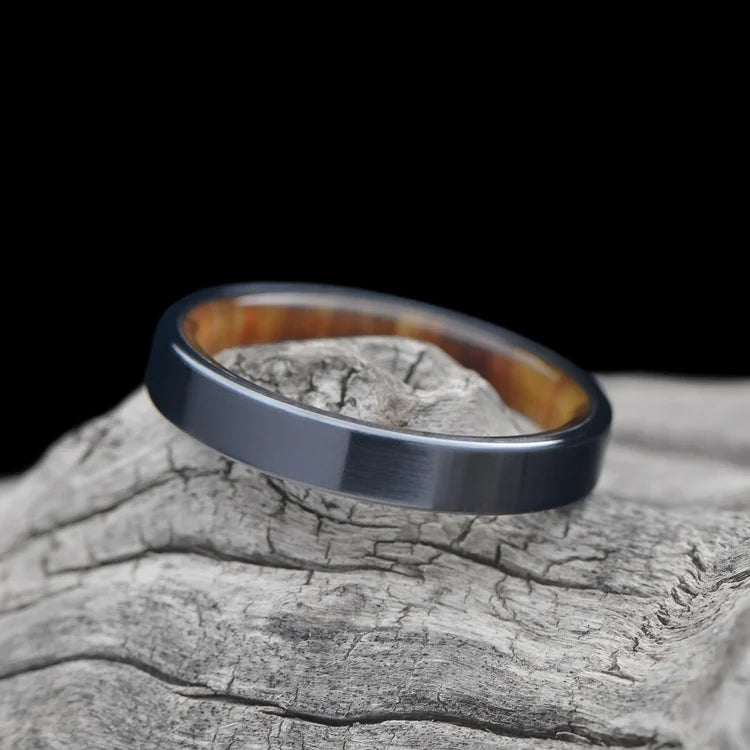 Black Titanium Ring with Silver Spalted Birch Inner Sleeve on White Sea Branch | Custom Wedding Band | 4mm Polished Flat Profile | Free Engraving