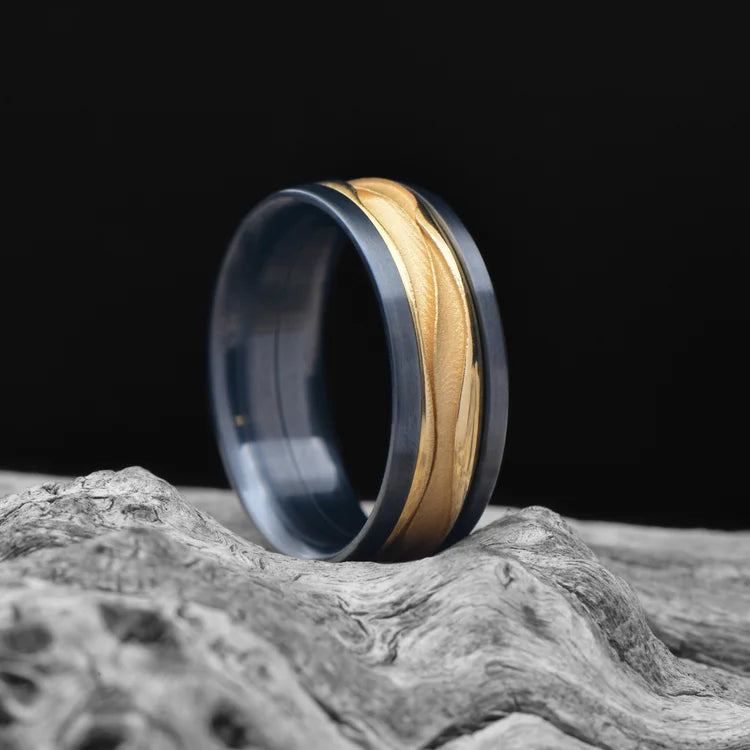 ALT text: Black Titanium Ring with 18KY Wave Central Inlay on White Sea Branch - Men's 8mm Polished Domed Profile Wedding Band with Free Engraving