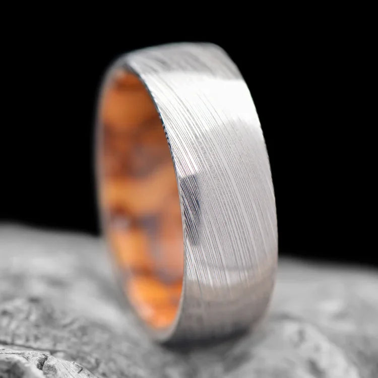 Heimskringla Wedding Band with Olivewood Inner Sleeve on white sea branch, 8mm men's ring, polished domed profile, unique design, free engraving available.