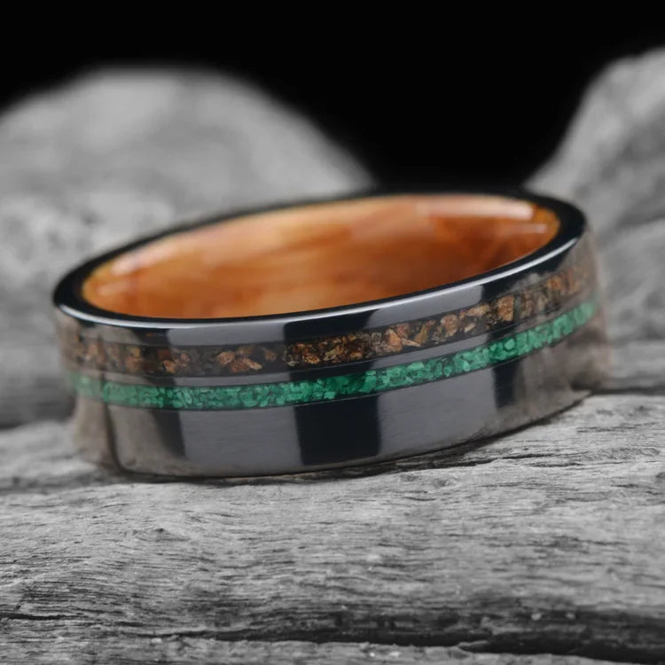 Black Titanium Wedding Band with Crushed T-Rex and Malachite Inlays, Whiskey Barrel Oak Inner Sleeve, 7mm Men's Unique Ring on White Sea Branch, Free Engraving Available