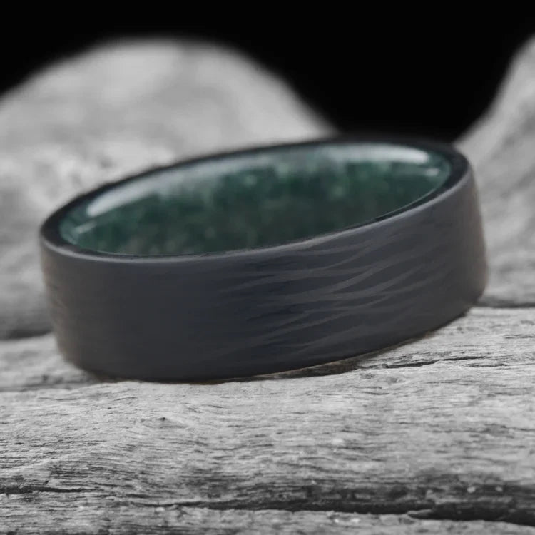 Men's Cross-Cut Wave Wedding Band with Moss Agate Inner Sleeve, 7mm, Unique Brushed Domed Profile, Free Engraving, displayed on a white sea branch.