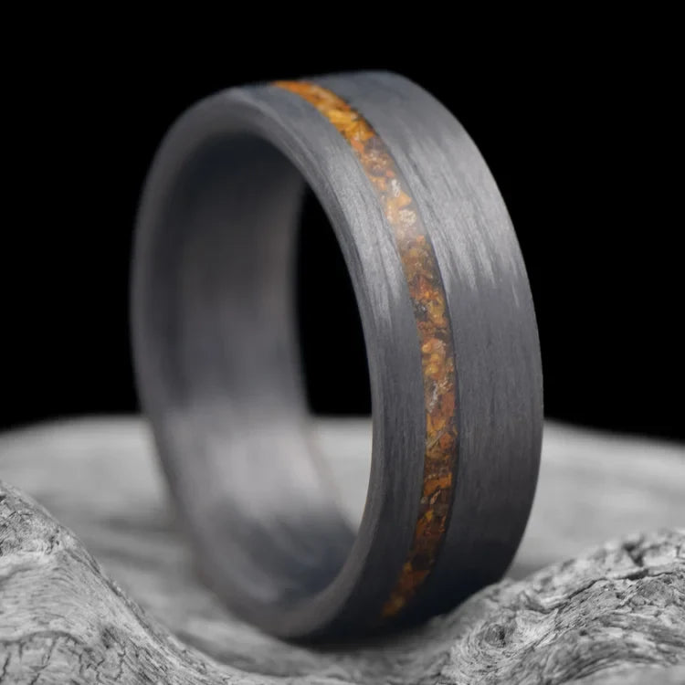 Unidirectional wedding band with tigers eye inlay, 8mm mens ring, matte finish, unique design, free engraving, displayed on white sea branch.