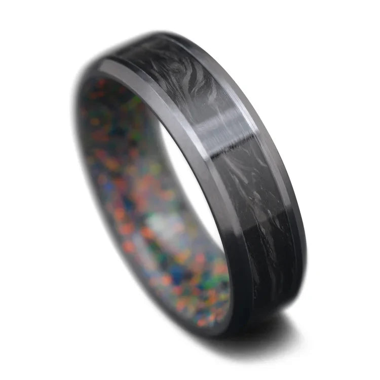 Mens 7mm black titanium wedding band featuring a central forged inlay and black fire opal inner sleeve, polished finish, available with free engraving, displayed on a white background.