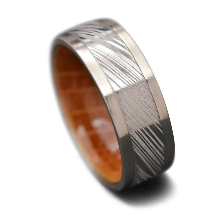 14KW wedding band with central Heimskringla inlay, whiskey barrel oak inner sleeve, 9mm mens polished wedding ring on white background, free engraving available