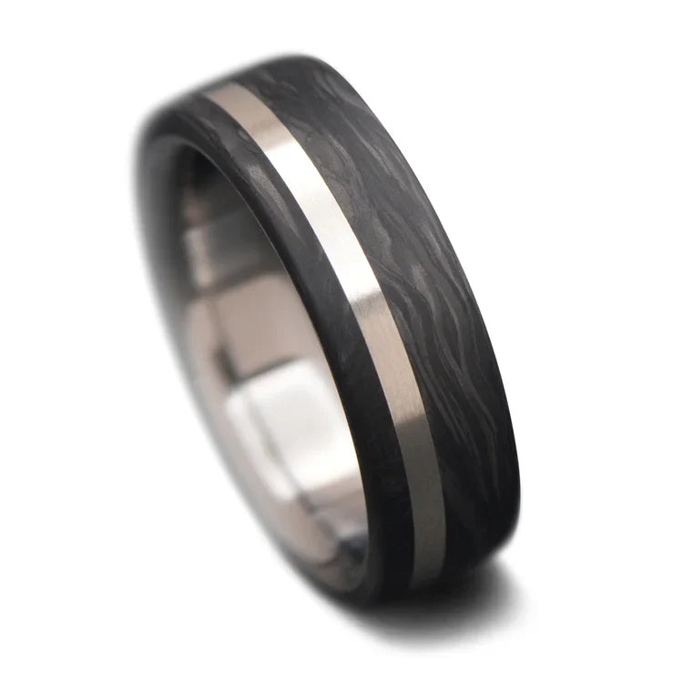 Forged titanium wedding band with 14K white gold inlay, 6mm mens ring, brushed flat profile, free engraving, on white background.
