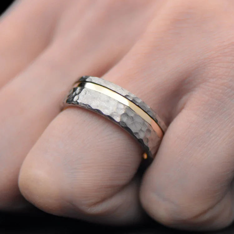 Mens titanium wedding band with 10KY inlay, 7mm faceted flat profile, unique custom design, free engraving, worn on a hand.