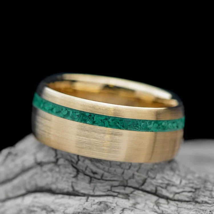 10KY gold wedding band with malachite inlay, 8mm mens ring, brushed domed profile, unique custom design, free engraving, displayed on white sea branch.