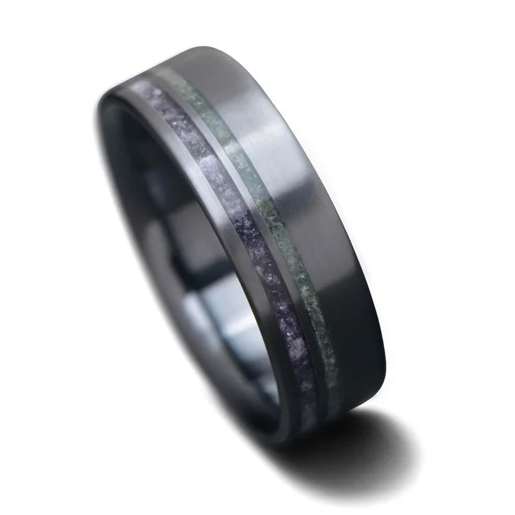 Black titanium wedding band featuring amethyst and moss agate inlays, custom design with free engraving, 7mm mens unique wedding ring on white background.