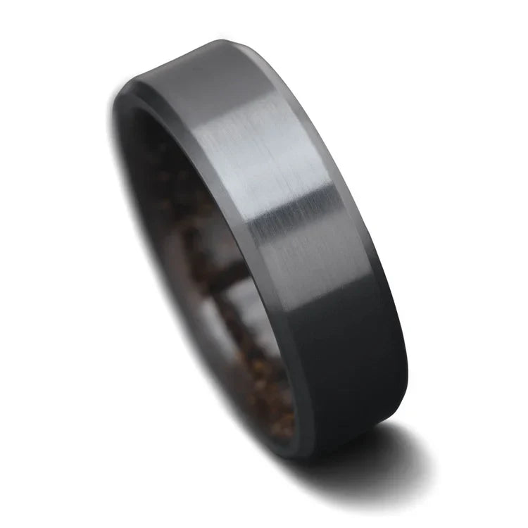 Black titanium wedding band for men, 8mm wide, featuring a brushed bevel profile and a unique T-Rex inner sleeve, offering free engraving, displayed on a white background.
