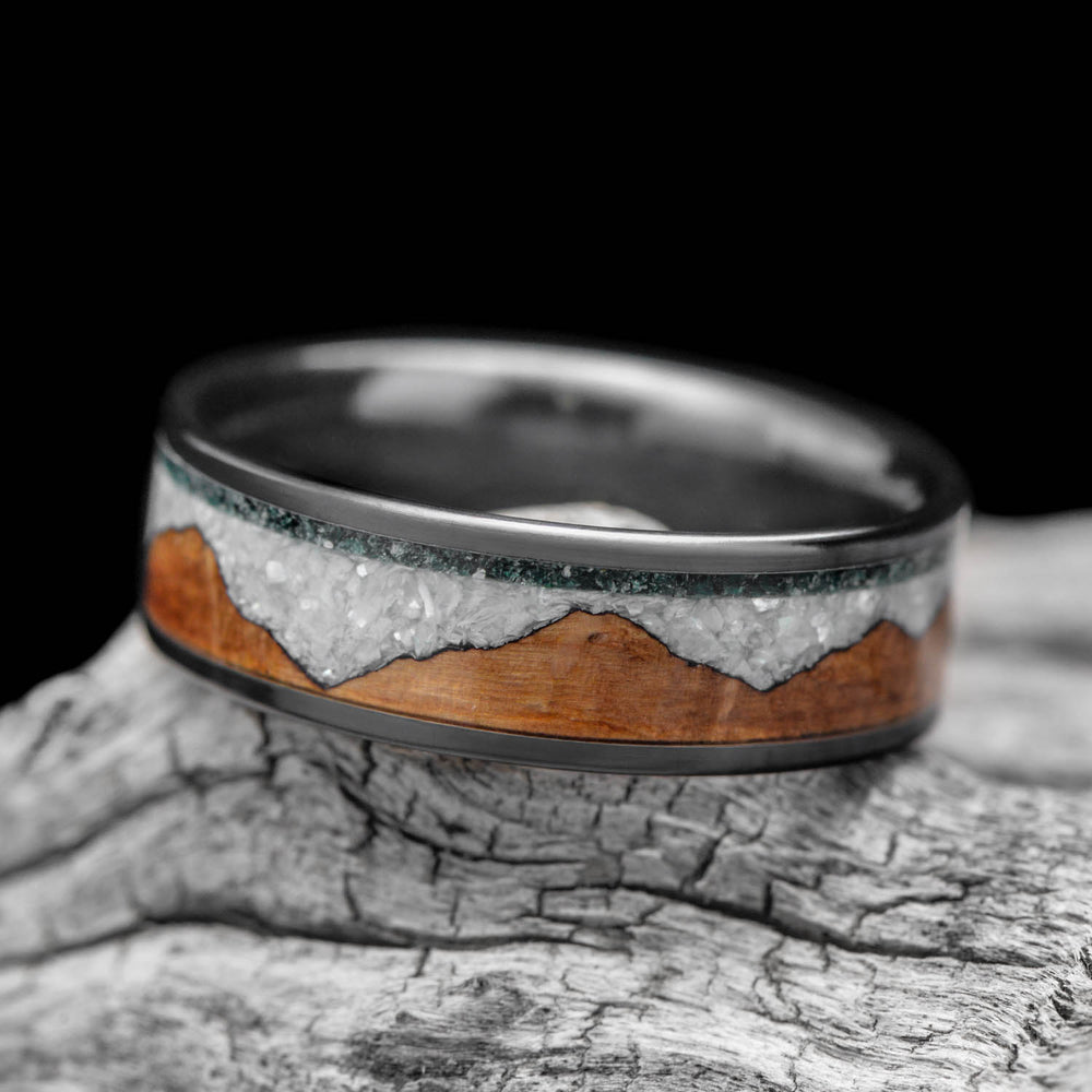 Custom wedding ring with a wood inlay and crushed white stone channel, designed from scratch by Sesto Synergy.