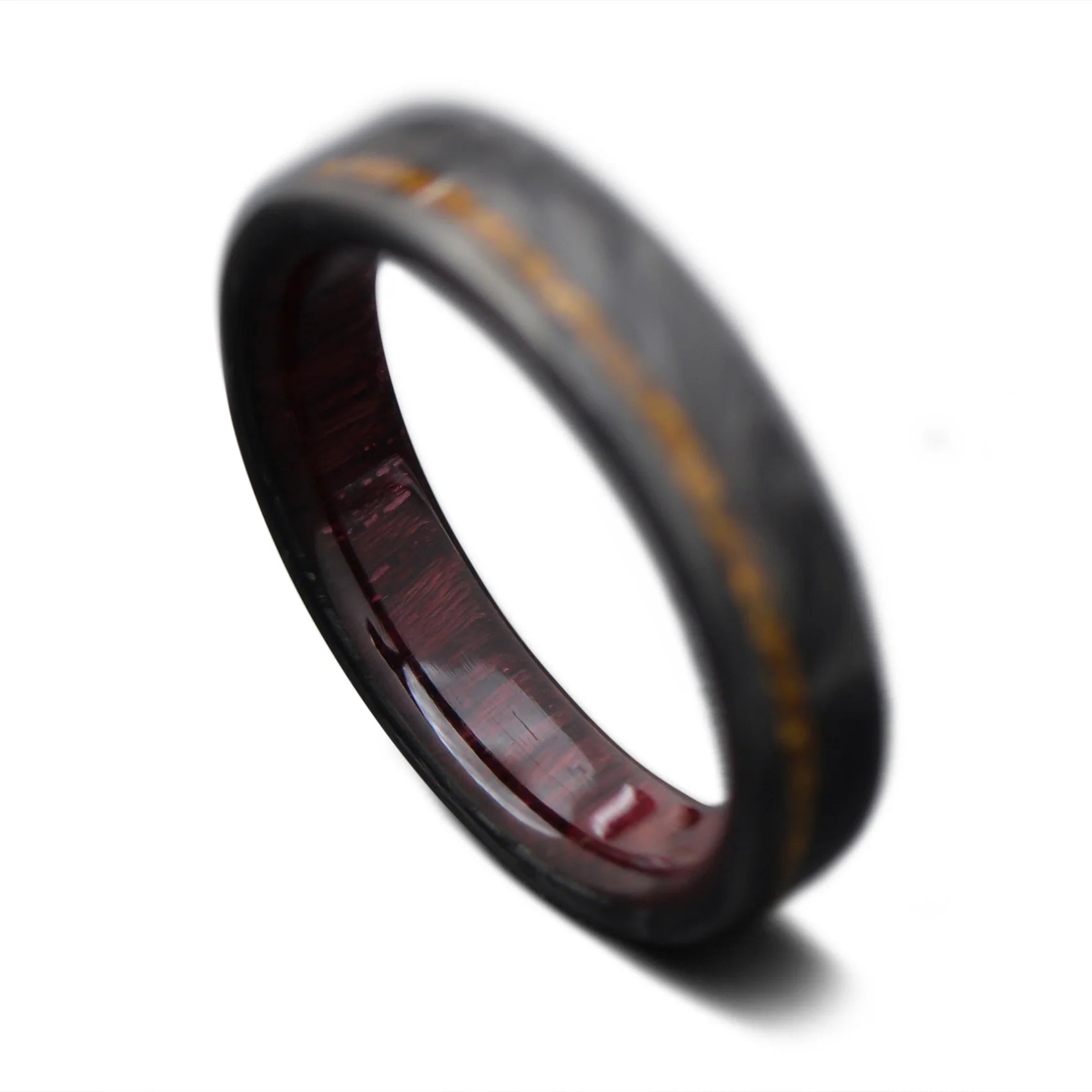 Forged carbon fiber ring with tiger eye and koa wood inner sleeve