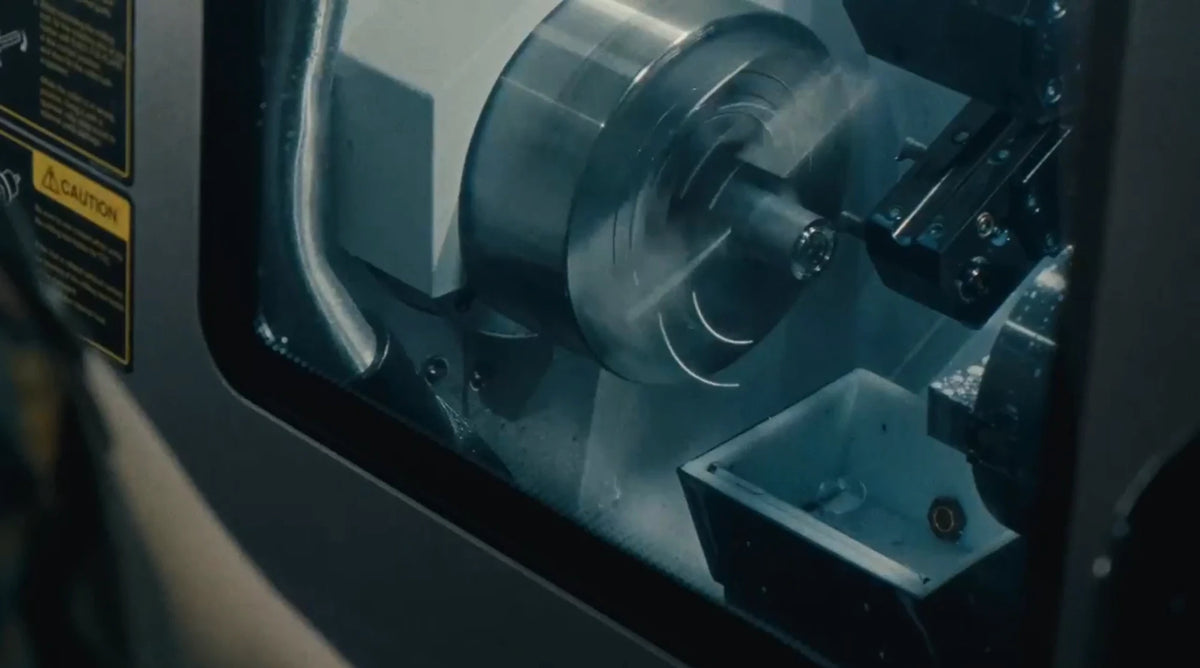 A ring being turned on a CNC lathe in the Sesto Synergy workshop