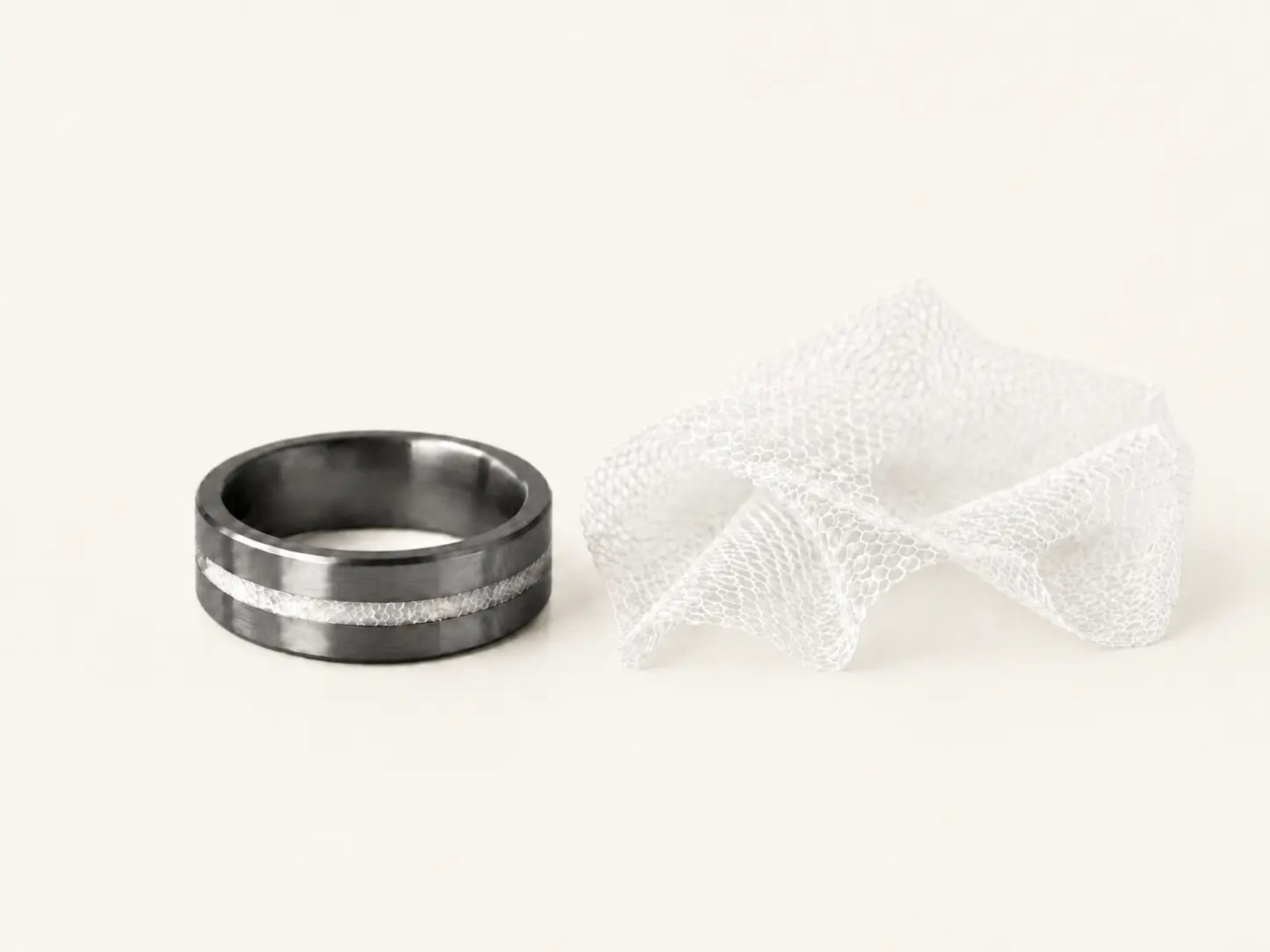 Men's tantalum wedding band inlaid with a piece of the bride's wedding dress.