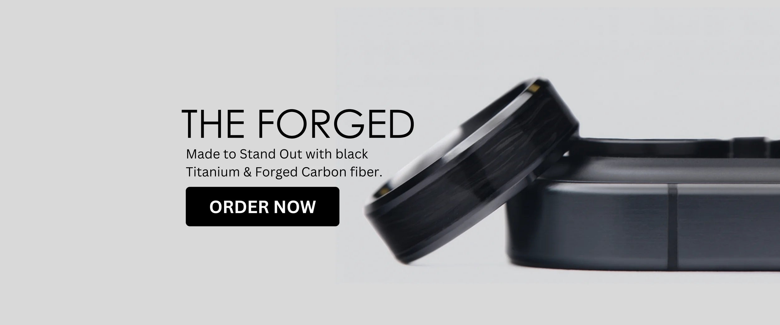 Discover The Forged: a bold wedding ring crafted from black titanium and forged carbon fiber. Durable, lightweight, and made to stand out from the ordinary.